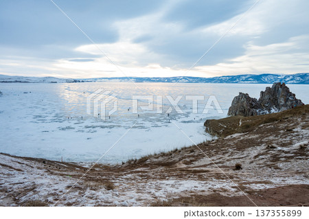 Scenery view of the Shaman rock at cape Burhan an iconic tourist attraction places on Olkhon island the largest island in Lake Baikal in eastern Siberia of Russia. Scenery view of the Shaman rock at cape Burhan an iconic tourist attraction places on Olkhon island the largest island in Lake Baikal in eastern Siberia of Russia. 137355899
