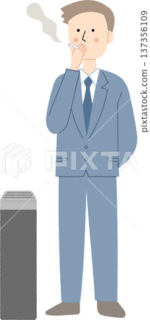 一名年輕的男性上班族在吸菸區抽煙。 一名年輕的男性上班族在吸菸區抽煙。 137356109