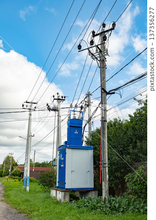 Transformer substation and power lines providing electricity to homes in a rural setting 137356277