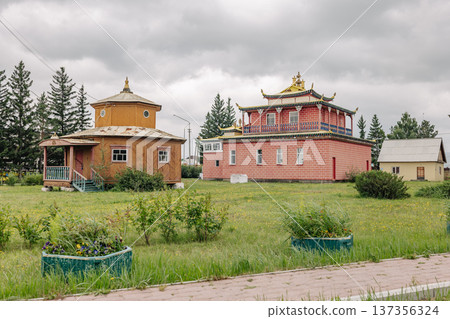 Traditional buddhist temple and round dugan are creating a beautiful landscape in cloudy summer weather Traditional buddhist temple and round dugan are creating a beautiful landscape in cloudy summer weather 137356324