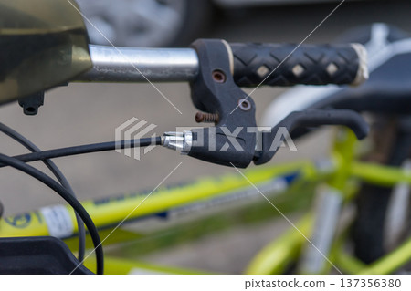 Brake lever and adjusting screw on a child's bicycle Brake lever and adjusting screw on a child's bicycle 137356380
