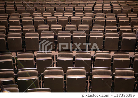 Empty rows of theater seats in an auditorium before a performance Empty rows of theater seats in an auditorium before a performance 137356399