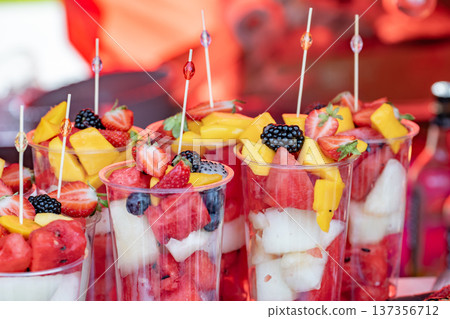 Refreshing fruit cups with watermelon, strawberry, mango, and blackberry for a healthy snack Refreshing fruit cups with watermelon, strawberry, mango, and blackberry for a healthy snack 137356712
