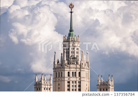 Kotelnicheskaya Embankment Building spire featuring a soviet star against a cloudy sky 137356784