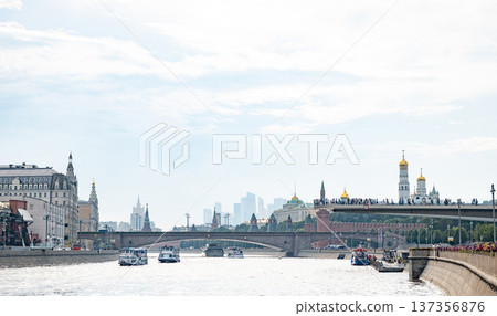 Moskva River cruise boats passing Zaryadye Park, Kremlin in Moscow, Russia 137356876