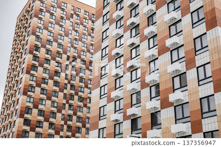 Modern residential buildings facades with many windows and air conditioning units Modern residential buildings facades with many windows and air conditioning units 137356947
