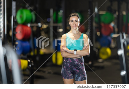Confident woman standing at gym, ready for training Confident woman standing at gym, ready for training 137357007