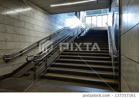 Underground subway station staircase leading up to street level exit, urban architecture Underground subway station staircase leading up to street level exit, urban architecture 137357161