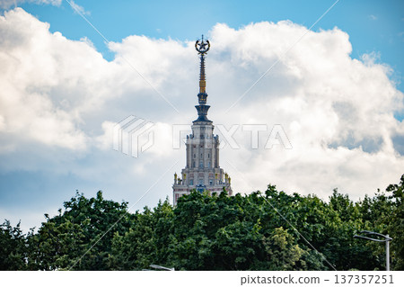 Moscow State University spire framing Stalinist architecture against cloudy sky 137357251