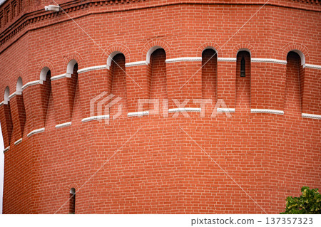Historical Moscow Kremlin wall with red brick pattern and battlements Historical Moscow Kremlin wall with red brick pattern and battlements 137357323