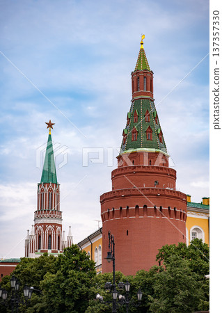 Moscow Kremlin towers, iconic Russian architecture against a cloudy sky Moscow Kremlin towers, iconic Russian architecture against a cloudy sky 137357330
