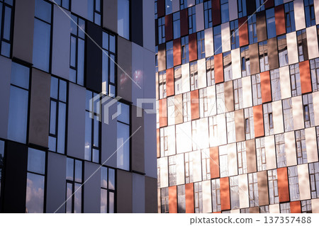 Modern architecture showing glass facades and abstract patterns on new high-rise buildings Modern architecture showing glass facades and abstract patterns on new high-rise buildings 137357488
