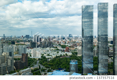 Moscow city skyline with modern skyscrapers, green parks, and Ostankino tower Moscow city skyline with modern skyscrapers, green parks, and Ostankino tower 137357518