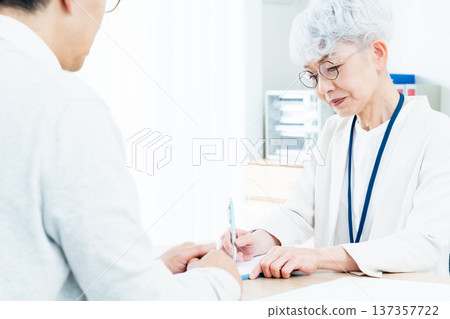 Senior woman receiving consultation 137357722