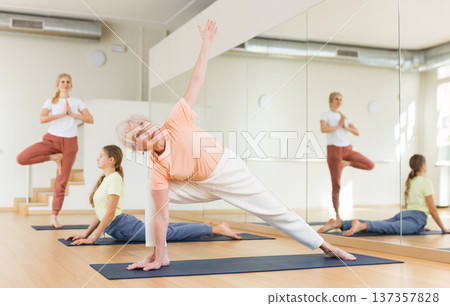 Senior woman exercising stretching workout Senior woman exercising stretching workout 137357828