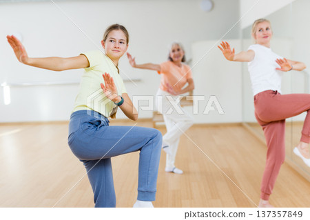 Teenager girl dancing in dance center Teenager girl dancing in dance center 137357849