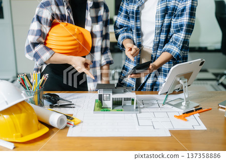 Engineer Teamwork Meeting, Drawing working on blueprint meeting for project working with partner on model building 137358886