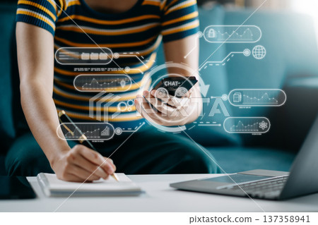 Woman using chat bot in smartphone intelligence Ai. Chat with AI Artificial Intelligence, developed by OpenAI generate. robot in online system. in office 137358941