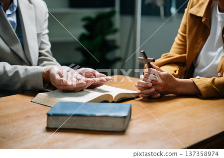 Christians are congregants join hands to pray and seek the blessings 137358974