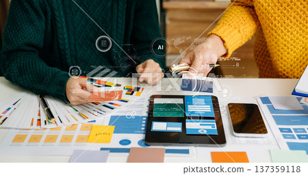 UX developer and ui designer brainstorming about mobile app interface wireframe design with customer breif and color code 137359118