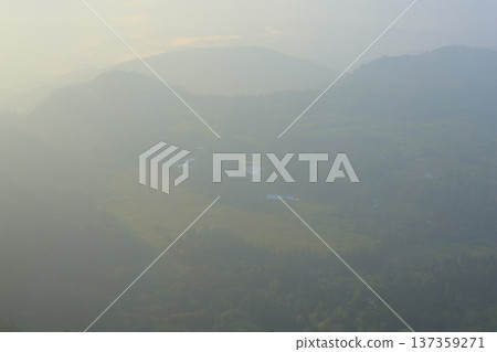 Mountains surrounded by fog Mountains surrounded by fog 137359271