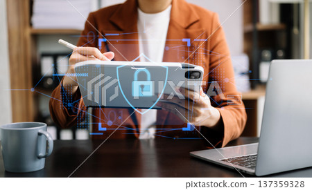 Cybersecurity and privacy concepts to protect data. Lock icon and network security technology. Man protecting personal data on smartphone tablet, virtual screen Cybersecurity and privacy concepts to protect data. Lock icon and network security technology. Man protecting personal data on smartphone tablet, virtual screen 137359328