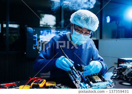 Professional electronics technician repairing computer motherboard in modern lab. Hardware engineering, cybersecurity, data technology, server maintenance Professional electronics technician repairing computer motherboard in modern lab. Hardware engineering, cybersecurity, data technology, server maintenance 137359431