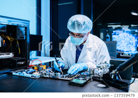 Professional electronics technician repairing computer motherboard in modern lab. Hardware engineering, cybersecurity, data technology, server maintenance Professional electronics technician repairing computer motherboard in modern lab. Hardware engineering, cybersecurity, data technology, server maintenance 137359479