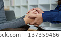 Therapeutic Connection. Counselor holding hands with patient for emotional support. 137359486
