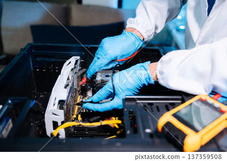Technician installing graphics card inside desktop PC. Computer hardware upgrade, motherboard wiring, IT repair service and technology Technician installing graphics card inside desktop PC. Computer hardware upgrade, motherboard wiring, IT repair service and technology 137359508