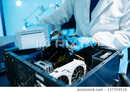 Professional technician repairing hard drive for data recovery in modern technology lab. Digital storage, cybersecurity, hardware repair and data protection concept. 137359516