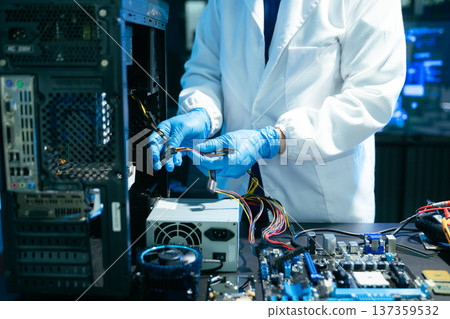 Professional technician repairing hard drive for data recovery in modern technology lab. Digital storage, cybersecurity, hardware repair and data protection concept. Professional technician repairing hard drive for data recovery in modern technology lab. Digital storage, cybersecurity, hardware repair and data protection concept. 137359532