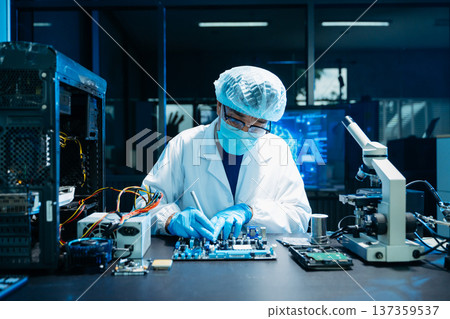 IT engineer repairing computer server hardware in laboratory. Electronics diagnostics, motherboard maintenance, cybersecurity infrastructure and data center IT engineer repairing computer server hardware in laboratory. Electronics diagnostics, motherboard maintenance, cybersecurity infrastructure and data center 137359537