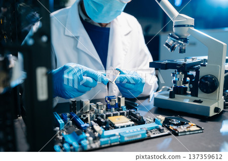Electronics assembly and RAM installation with high-tech components. Ideal for showcasing advanced technology and computer engineering concepts Electronics assembly and RAM installation with high-tech components. Ideal for showcasing advanced technology and computer engineering concepts 137359612