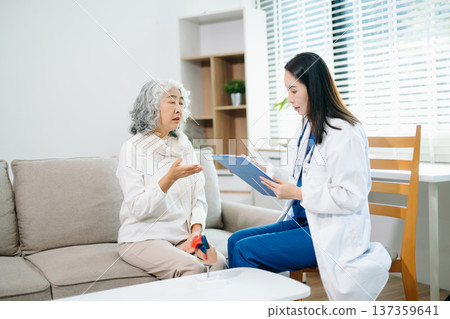 Female doctor explaining heart health with anatomy model to senior woman. Healthcare, cardiology, medical consultation, elderly care, prevention 137359641