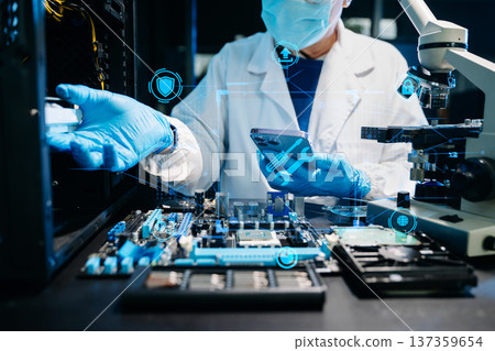 IT technician repairing smartphone and working on motherboard in a modern lab. Electronics, tech repair, digital tools, precision work, and professional IT services 137359654