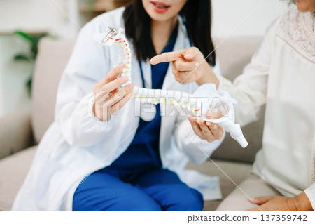 Doctor examining elderly woman with knee pain during home healthcare visit, highlighting arthritis treatment, senior support, medical consultation and compassionate care. Doctor examining elderly woman with knee pain during home healthcare visit, highlighting arthritis treatment, senior support, medical consultation and compassionate care. 137359742