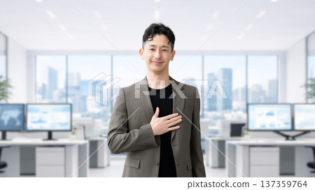 Male businessman standing with his hand on his chest 137359764