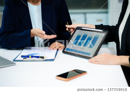 Business team meeting. professional investor working new start up project. Finance task. with smart phone and laptop and digital tablet computer Business team meeting. professional investor working new start up project. Finance task. with smart phone and laptop and digital tablet computer 137359918