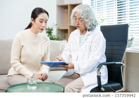 Psychiatrist comforting stressed patient during mental health therapy. Psychology counseling, emotional support, depression and anxiety treatment Psychiatrist comforting stressed patient during mental health therapy. Psychology counseling, emotional support, depression and anxiety treatment 137359942