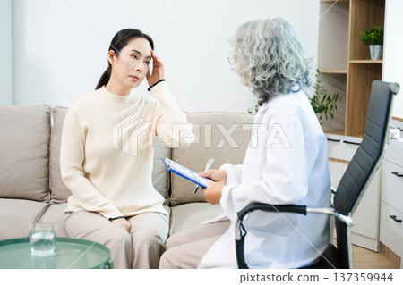 Psychiatrist comforting stressed patient during mental health therapy. Psychology counseling, emotional support, depression and anxiety treatment Psychiatrist comforting stressed patient during mental health therapy. Psychology counseling, emotional support, depression and anxiety treatment 137359944