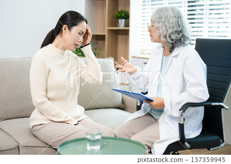 Psychiatrist comforting stressed patient during mental health therapy. Psychology counseling, emotional support, depression and anxiety treatment Psychiatrist comforting stressed patient during mental health therapy. Psychology counseling, emotional support, depression and anxiety treatment 137359945
