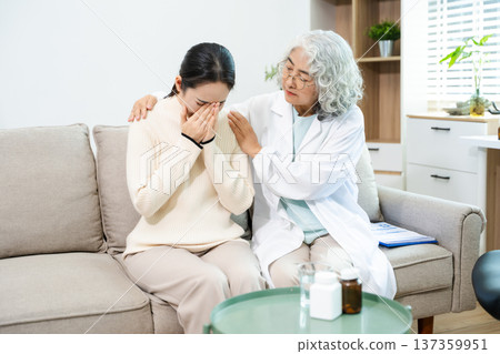 Psychiatrist comforting stressed patient during mental health therapy. Psychology counseling, emotional support, depression and anxiety treatment Psychiatrist comforting stressed patient during mental health therapy. Psychology counseling, emotional support, depression and anxiety treatment 137359951