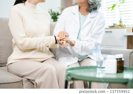 Psychiatrist comforting stressed patient during mental health therapy. Psychology counseling, emotional support, depression and anxiety treatment Psychiatrist comforting stressed patient during mental health therapy. Psychology counseling, emotional support, depression and anxiety treatment 137359952
