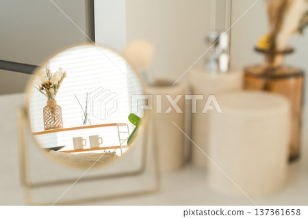 Makeup tools, cosmetics, makeup, and a tabletop mirror on the table 137361658