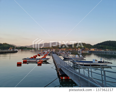 This is a view of an island village at sunset. This is a view of an island village at sunset. 137362217