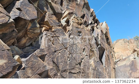 Rock drawings with ancient petroglyphic image of an ancient deity. Area Tamgaly. 137362234