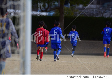 A boy playing football A boy playing football 137362489