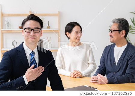 Businessman and couple discussing business Businessman and couple discussing business 137362580
