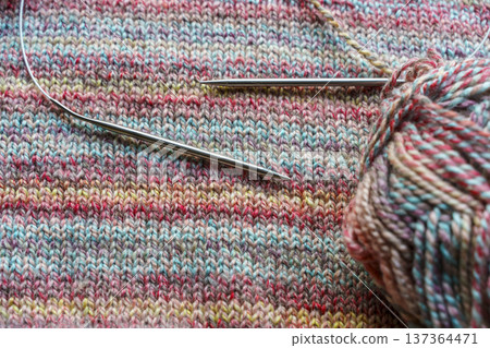 Cozy Handmade Knitting Scene with Colorful Wool Yarn Balls and Wooden Needles Cozy Handmade Knitting Scene with Colorful Wool Yarn Balls and Wooden Needles 137364471